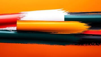 Abstract composition of vibrant paint strokes on an orange background, showcasing color blending photo