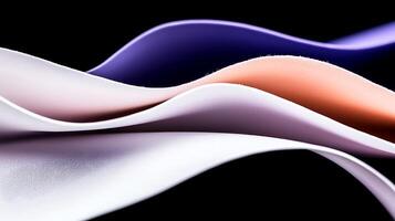 Abstract flowing fabric waves in soft pastel colors on a dark background, creating a serene atmosphere photo