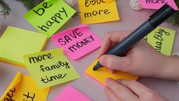 2026 goals Woman writing promises and aims. Preparation for new year new life new me. Visualizing wish list for 2026. Dreams plan action resolutions for coming year. Inspirational self improvement concept video