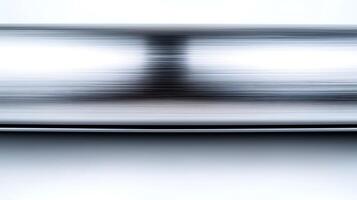 Abstract metallic surface with blurred reflections creating a sense of motion and depth photo