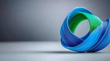 Abstract sculpture made of colorful twisted ribbons on a minimalist background photo