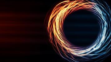 Abstract swirl of orange and blue light creating a dynamic sense of motion against a dark backdrop photo