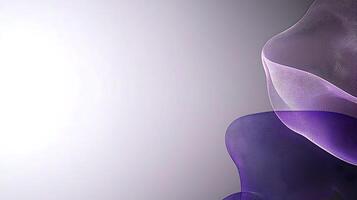 Abstract waves of purple and translucent fabric flowing gracefully across a soft gradient background photo