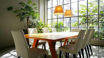 Bright modern dining area with wooden table and white chairs, surrounded by greenery and large windows photo