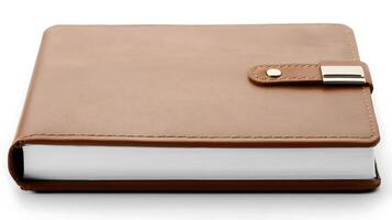 Brown leather-bound notebook with a clasp, placed on a white surface, ideal for journaling photo