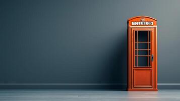 Classic red telephone booth standing against a minimalist gray wall in a modern interior setting photo