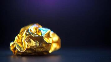 Close-up of a crumpled golden foil against a dark background, highlighting texture and shine photo