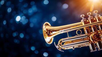 Close-up of a gleaming trumpet against a blurred blue background with sparkling lights photo