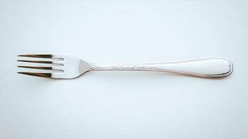 Close-up of a shiny silver fork resting on a light background, highlighting its elegant design photo