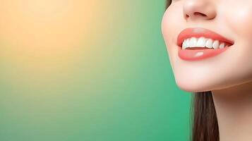 Close-up of a smiling woman with flawless teeth against a soft gradient background photo