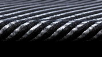 Close-up of a textured fabric with alternating black and white stripes, emphasizing its weave photo