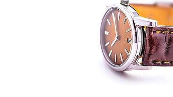 Close-up of an elegant wristwatch with a brown leather strap and a stylish dial, showcasing craftsmanship photo
