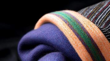 Close-up of colorful, textured fabric showcasing intricate patterns and vibrant colors folded elegantly photo