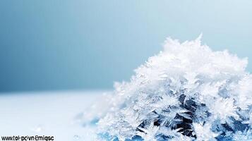Close-up of intricate snowflakes resting on a smooth surface with a soft blue background photo