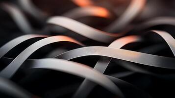 Close-up of intertwined metallic ribbons reflecting light, creating an abstract visual effect photo