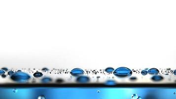 Close-up of shimmering water droplets on a smooth surface with a blurred background photo