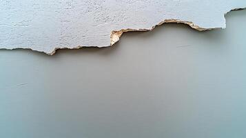 Close-up of peeling wall paint revealing layers beneath, showcasing texture and color contrast photo