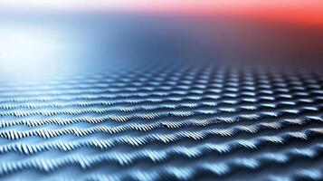Close-up of textured metallic surface with intricate patterns reflecting ambient light photo