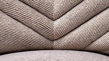 Close-up of textured fabric in a chevron pattern, highlighting intricate design and color tones photo