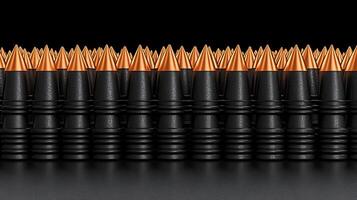 Close-up view of precision-engineered bullets arranged in a neat row against a dark background photo