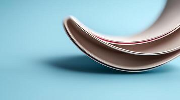 Close-up view of stacked ceramic plates on a soft blue background, showcasing their elegant curves photo