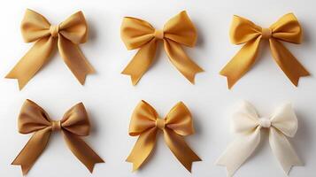 Collection of elegant golden and cream bows arranged symmetrically on a white background photo