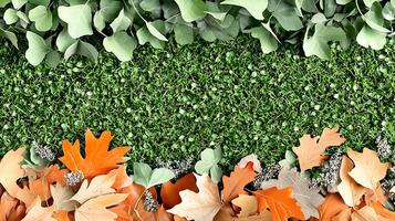 Colorful autumn leaves scattered on vibrant green grass with subtle foliage in the background photo