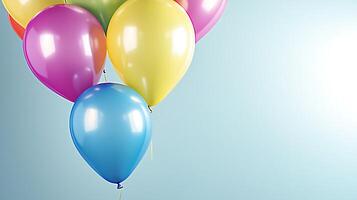Colorful balloons floating against a soft blue background, creating a festive atmosphere photo