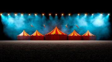 Colorful circus tents illuminated by bright lights, with acrobats performing in the background photo