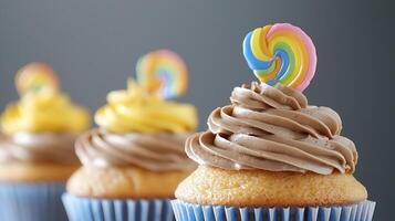 Colorful cupcakes with swirled frosting and vibrant toppers, set against a soft grey backdrop photo