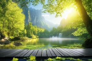 A wooden bridge over a river and waterfall in the forest photo