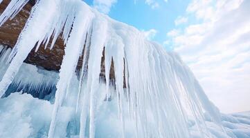 Frozen icicles cascading from a cliff face photo