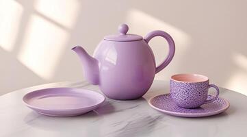 Pastel purple tea set on a marble table photo