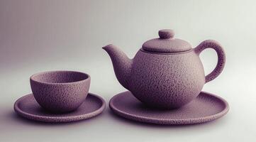 A purple tea pot and cup on a white surface photo