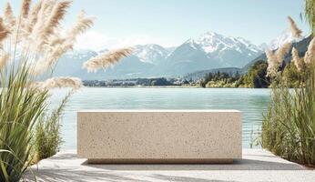 Outdoor bench by a serene lake, mountains in the background photo