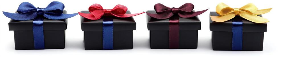 Four black gift boxes with colorful bows photo