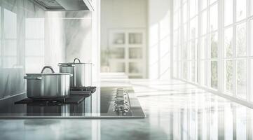 Modern kitchen with stainless steel cookware on a stovetop, overlooking bright windows photo
