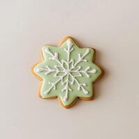 A cookie decorated with a snowflake on a white background photo