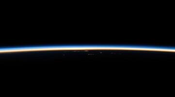 The earth from space, with the sun shining brightly photo
