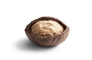 Creamy dessert in a coconut shell photo