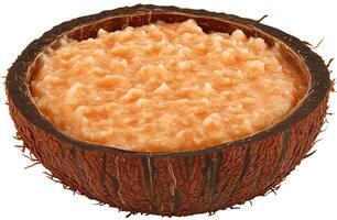 Orange-toned, creamy spread in a coconut shell photo