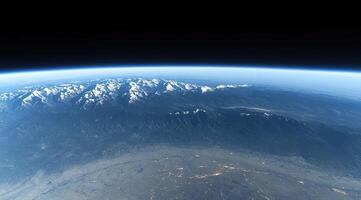 Earth's mountains and valleys from space. Vast mountain ranges with snowy peaks, valleys, and clouds, detailed view photo