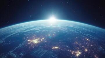 Earth, bathed in sunrise, from space. Vast expanse of atmosphere and continents, illuminated by a brilliant sun photo
