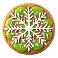 Round, festive gingerbread cookie decorated with a large snowflake design. Green icing accents the edges and the snowflake photo