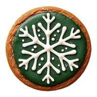 A green and white cookie decorated with a snowflake photo