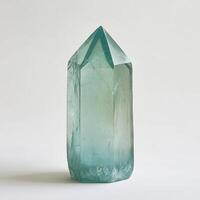 Teal-hued crystal point photo