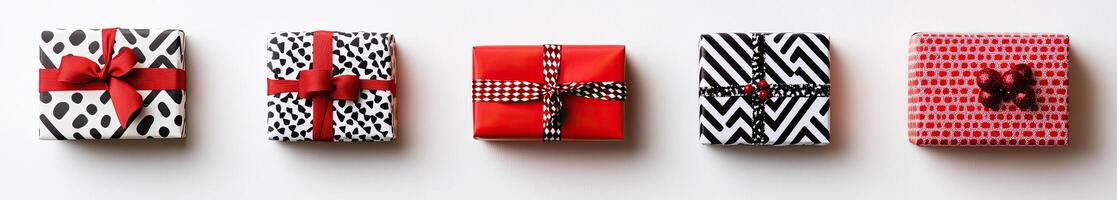 Four wrapped presents with red and black ribbon photo