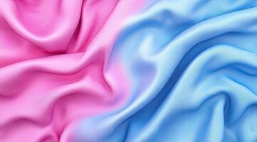Soft, draped fabric in a gradient of pink and blue photo