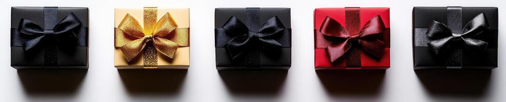 A group of four black, red, yellow and blue boxes photo