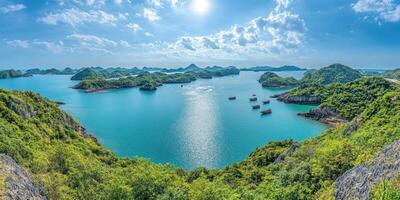 Turquoise waters, lush islands, and sunny skies photo